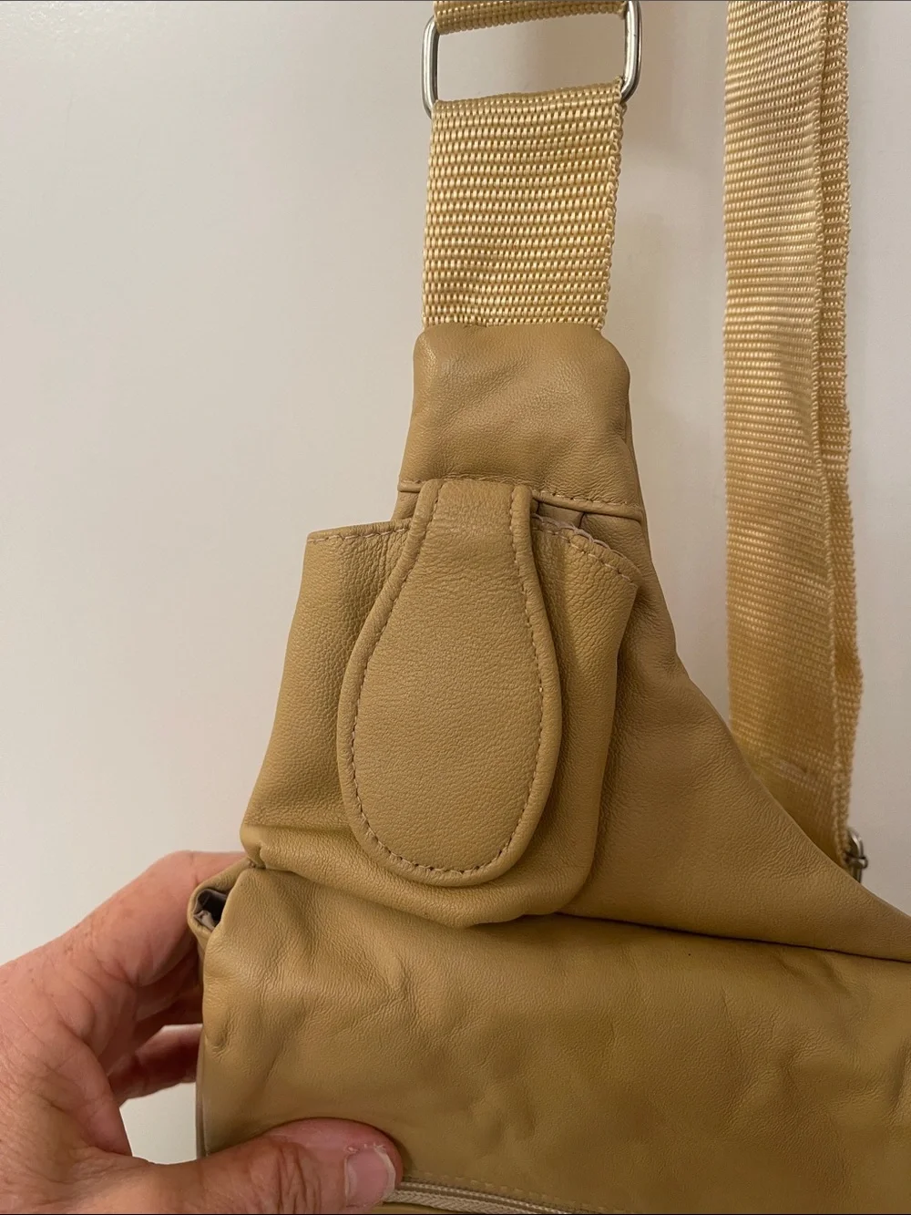 Buxton tan crossbody sling backpack